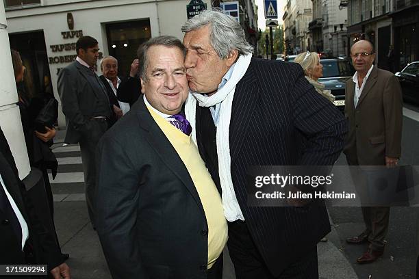 Paul-Loup Sulitzer poses with Jean-Pierre Castaldi during his book signing at Club Des Saints-Peres on June 25, 2013 in Paris, France.