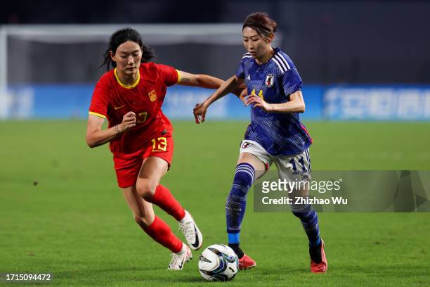 Nakashima Yoshino of Japan competes for the ball with Yang Lina of China during the 19th Asian Games Women's Semifinal match between China and Japan...