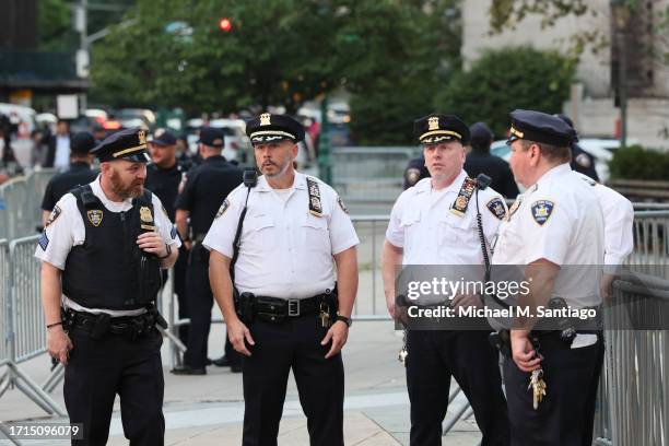 Officers stand guard before the second day of former President Donald Trump civil fraud trial begins at New York State Supreme Court on October 03,...