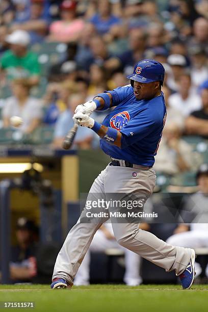 Luis Valbuena of the Chicago Cubs singles in the top of the first inninf against the Milwaukee Brewers at Miller Park on June 25, 2013 in Milwaukee,...