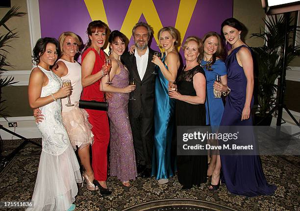 Director Sam Mendes poses with female cast members at an after party celebrating the press night performance of 'Charlie And The Chocolate Factory'...