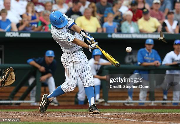 Pat Valaika of the UCLA Bruins hits an RBI single in the third inning against the Mississippi State Bulldogs during game two of the College World...