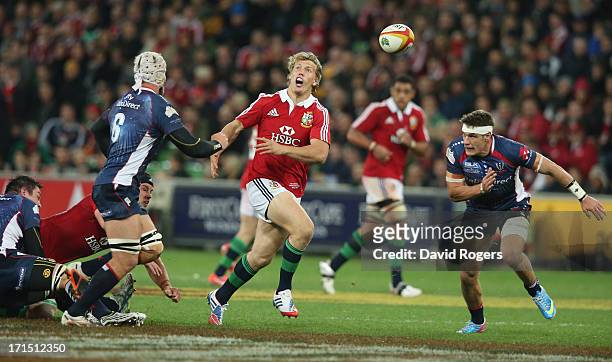 Billy Twelvetrees of the Lions attempts to gather the loose ball during the International Tour Match between the Melbourne Rebels and the British &...
