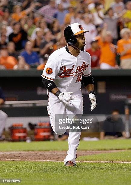 Alexi Casilla of the Baltimore Orioles follows his three RBI home run in the seventh inning of the Orioles 6-3 win over the Cleveland Indians at...
