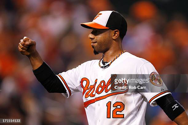 Alexi Casilla of the Baltimore Orioles celebrates after the Orioles defeated the Cleveland Indians 6-3 at Oriole Park at Camden Yards on June 25,...