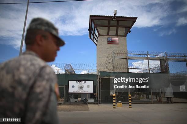 Military officer stands near the entrance to Camp VI at the U.S. Military prison for 'enemy combatants' on June 25, 2013 in Guantanamo Bay, Cuba....