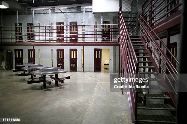 Prison cells are viewed in camp 6 where prisoners are housed in a communal facility at the U.S. Military prison for 'enemy combatants' on June 25,...