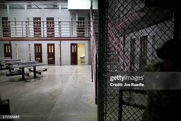 Prison cells are viewed in camp 6 where prisoners are housed in a communal facility at the U.S. Military prison for 'enemy combatants' on June 25,...