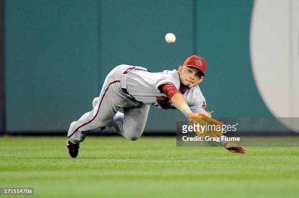 Gerardo Parra of the Arizona Diamondbacks dives for and misses a double in the eighth inning by Steve Lombardozzi of the Washington Nationals at...