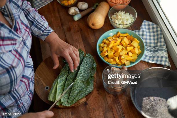 cutting kale on wooden board for the holidays - cabbage family stock pictures, royalty-free photos & images