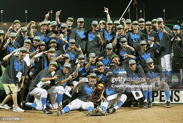 The UCLA Bruins celebrate with the championship trrophy after defeating the Mississippi State Bulldogs during game two of the College World Series...