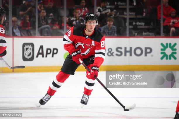 Jack Hughes of the New Jersey Devils skates during the preseason game against the New York Islanders on October 2, 2023 at the Prudential Center in...