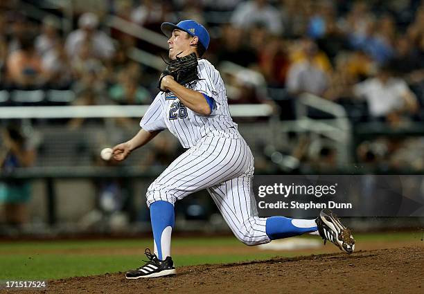 David Berg of the UCLA Bruins pitches the ninth inning against the Mississippi State Bulldogs during game two of the College World Series Finals on...