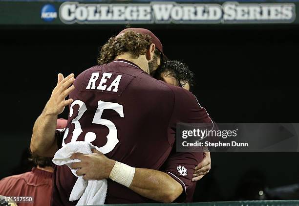 Wes Rea and Nick Ammirati of the Mississippi State Bulldogs embrace after losing to the UCLA Bruins during game two of the College World Series...