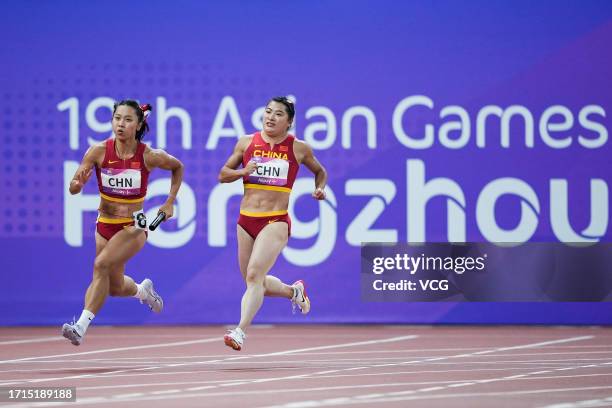 Ge Manqi and Yuan Qiqi of Team China compete in the Athletics - Women's 4 x 100m Relay on day ten of the 19th Asian Games at Hangzhou Olympic Sports...