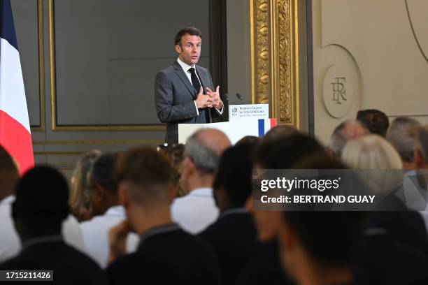 French President Emmanuel Macron delivers a speech during a ceremony dedicated to French athletes who won medals at the Virtus Global Gamesrrive at...