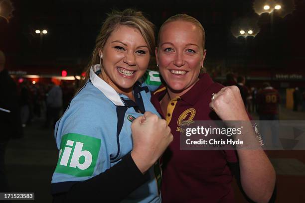 Blues fan and Maroons fan arrive for game two of the ARL State of Origin series between the Queensland Maroons and the New South Wales Blues at...