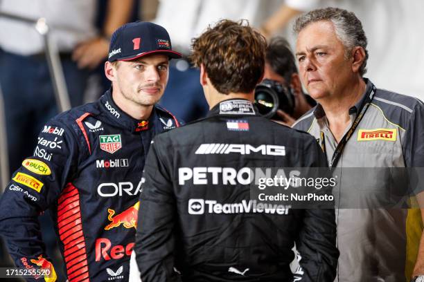 Max Verstappen of Netherlands, Oracle Red Bull Racing, George Russell of United Kingdom, Mercedes - AMG PETRONAS and Mario Isola Pirelli Motorsport...