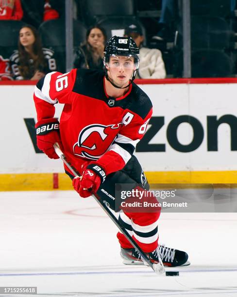 Jack Hughes of New Jersey Devils skates against the New York Islanders during a preseason game at the Prudential Center on October 02, 2023 in...