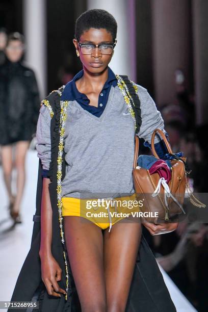 Model walks the runway during the Miu Miu Ready to Wear Spring/Summer 2024 fashion show as part of the Paris Fashion Week on October 3, 2023 in...