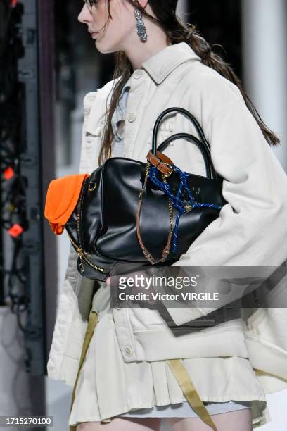 Model walks the runway during the Miu Miu Ready to Wear Spring/Summer 2024 fashion show as part of the Paris Fashion Week on October 3, 2023 in...