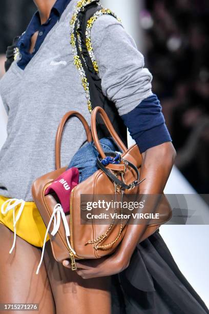 Model walks the runway during the Miu Miu Ready to Wear Spring/Summer 2024 fashion show as part of the Paris Fashion Week on October 3, 2023 in...