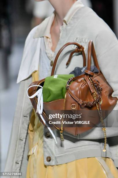 Model walks the runway during the Miu Miu Ready to Wear Spring/Summer 2024 fashion show as part of the Paris Fashion Week on October 3, 2023 in...