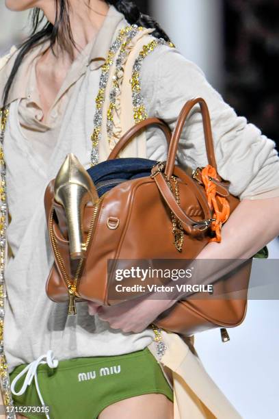 Model walks the runway during the Miu Miu Ready to Wear Spring/Summer 2024 fashion show as part of the Paris Fashion Week on October 3, 2023 in...