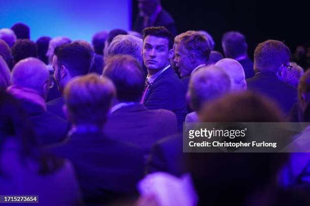Delegates wait for Home Secretary Suella Braverman to make her speech on the third day of the Conservative Conference on October 03, 2023 in...