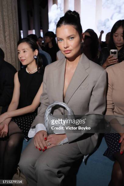 Adriana Lima attends the Miu Miu Womenswear S/S 2024 show as part of Paris Fashion Week at Palais d'Iena on October 03, 2023 in Paris, France.