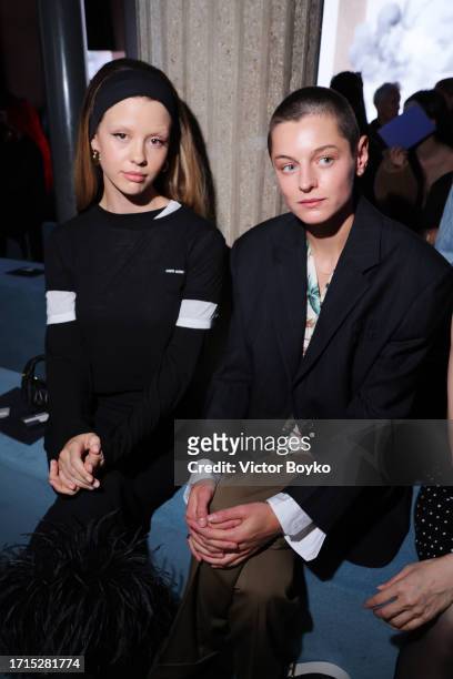 Mia Goth and Emma Corrin attend the Miu Miu Womenswear S/S 2024 show as part of Paris Fashion Week at Palais d'Iena on October 03, 2023 in Paris,...