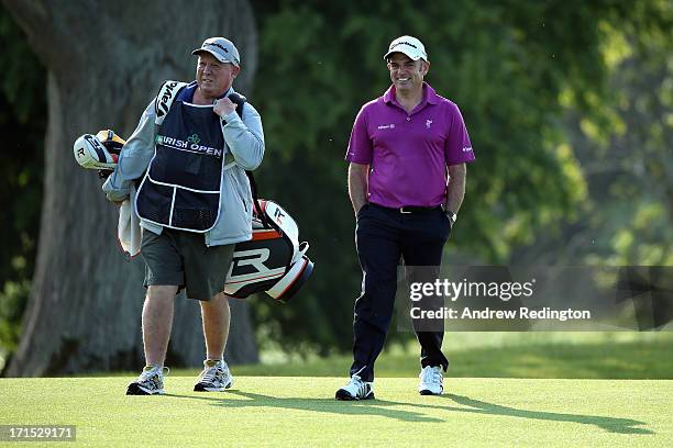 Paul McGinley of Ireland is pictured with his caddie "Edinburgh Jimmy" Rae during the pro-am event prior to the start of the Irish Open at Carton...