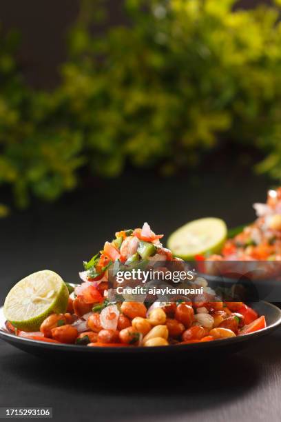 peanut masala chaat - crunchy salad stock pictures, royalty-free photos & images