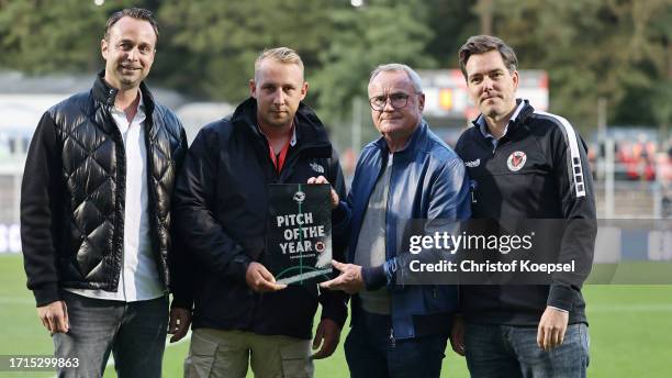 Manfred Schnieders, chairman of match play of DFB hands out the „Pitch-of-the-Year-Award“ to Markus Schwalm, head of greenkeeping of Kölner...