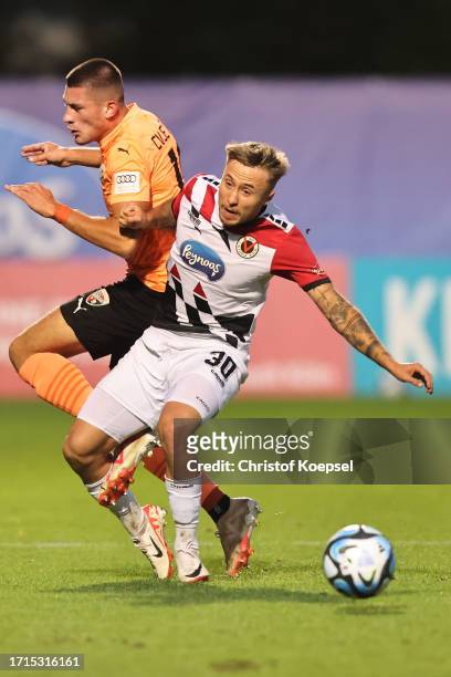 Luca Marseiler of Viktoria Köln challenges Mladen Cvjetinovic of FC Ingolstadt during the 3. Liga match between Viktoria Köln and FC Ingolstadt 04 at...
