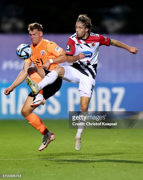 David Philipp of Viktoria Köln challenges Simon Lorenz of FC Ingolstadt during the 3. Liga match between Viktoria Köln and FC Ingolstadt 04 at...