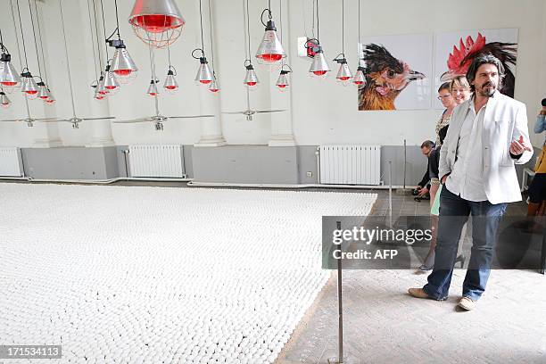 Artist Koen Van Mechelen stands near 'De Wachtkamer', his art work with 40000 eggs, during it's inauguration on the launch of the 'Kom uit en Vlieg'...