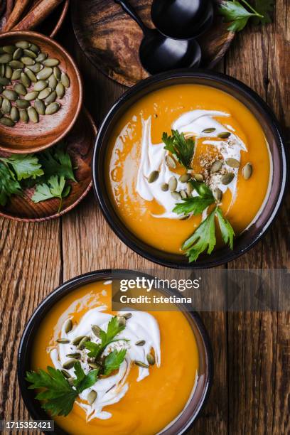pumpkin soup in ceramic bowl, autumn comfort food, thanksgiving favorite meal - pumpkin soup stock pictures, royalty-free photos & images