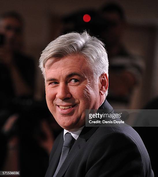 Carlo Ancelotti smiles as he attends a press conference where he was presented as the new head coach of Real Madrid at Estadio Bernabeu on June 26,...