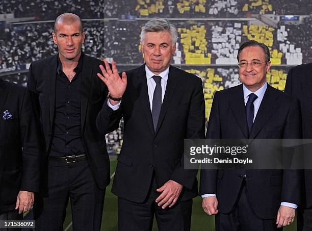 Carlo Ancelotti stands alongside former player Zinedine Zidane and club president Florentino Perez while being presented as the new head coach of...