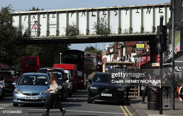 Graffiti reading 'Free Palestine' is pictured on a railway bridge in Golders Green, north London on October 9, 2023.