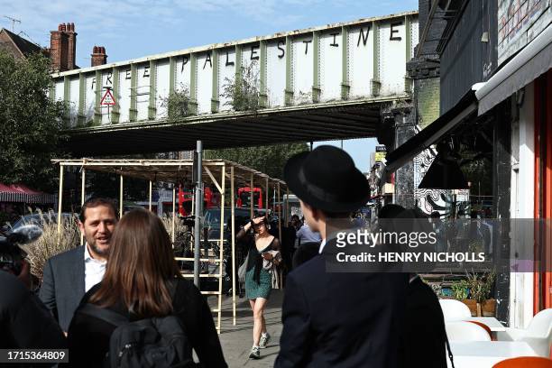 Graffiti reading 'Free Palestine' is pictured on a railway bridge in Golders Green, north London on October 9, 2023.