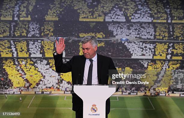 Carlo Ancelotti waves while being presented as the new head coach of Real madrid at Estadio Bernabeu on June 26, 2013 in Madrid, Spain.