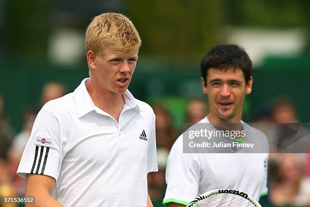 Kyle Edmund and Jamie Baker of Great Britain look on during their Gentlemen's Doubles first round match against David Marrero of Spain and Andreas...