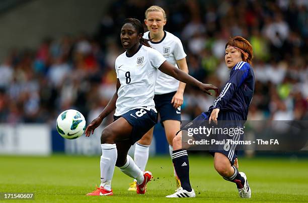 Anita Asante of England in action with Mizuho Sakaguchi of Japan during the International friendly match between England and Japan at the Pirelli...