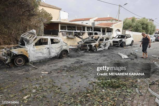 Man inspects the damage in the southern Israeli city of Ashkelon after a rocket attack from Gaza on October 9, 2023. Israel relentlessly pounded the...