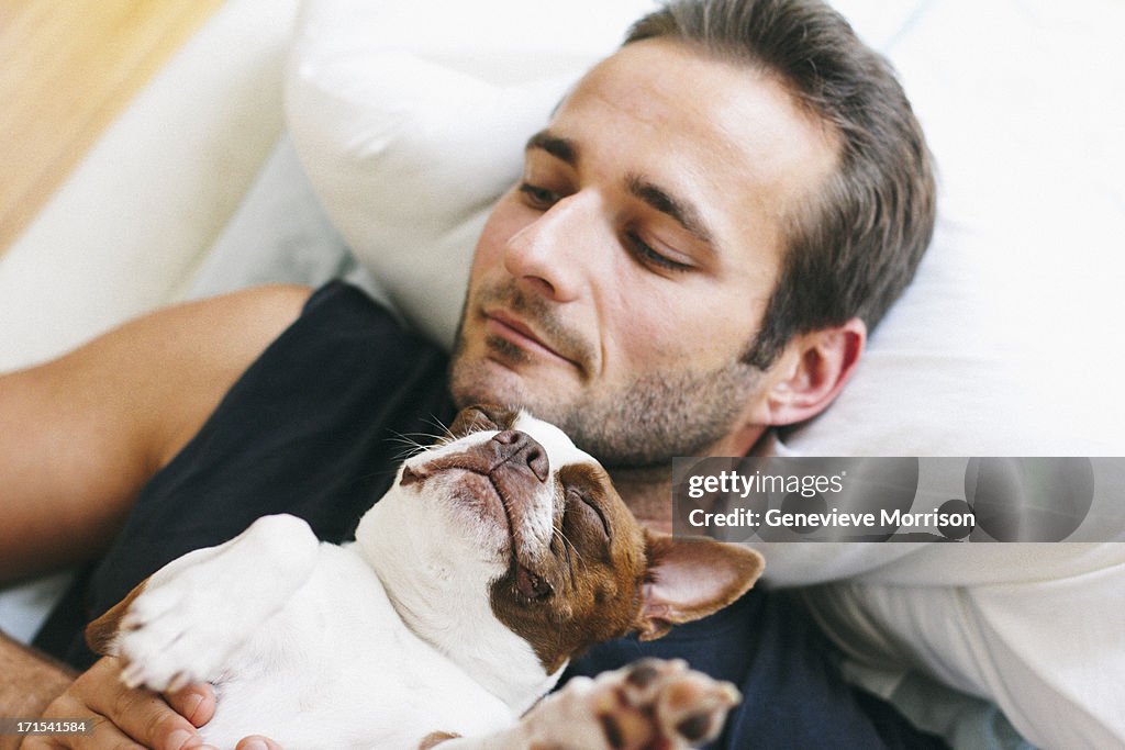 Handsome man and red boston terrier