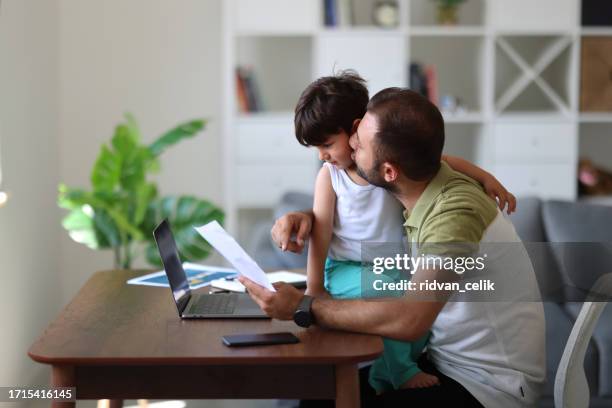 father trying to work from home - epidemic sound stock pictures, royalty-free photos & images