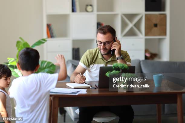 father trying to work from home - epidemic sound stock pictures, royalty-free photos & images