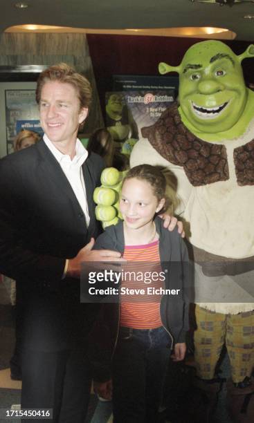 American actor Matthew Modine and his daughter, Ruby, pose with a costumed 'Shrek' performer at a screening of 'Shrek,' New York, New York, May 15,...